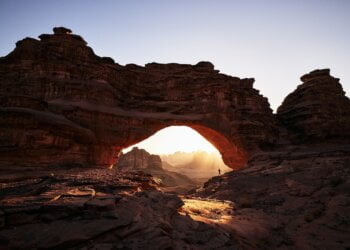 a large rock formation with a small hole in the middle of it